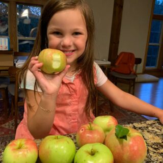 It is a good year for our apple trees and this girl who loves to eat them.